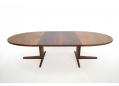 1962 design oval top dining table in rosewood with 2 leaves.
