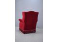 High back armchair with winged head rest, upholstered in red velour