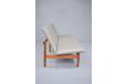 Low relaxed lounge sofa with restored teak frame. Finn Juhl's master piece 