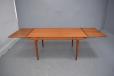 Midcentury Arne Hovmand Olsen design teak dining table with 2 pull out leaves for sale