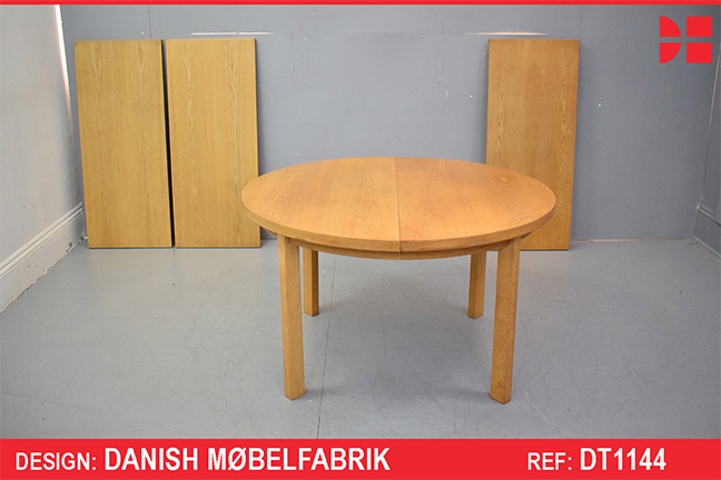 Light oak round dining table produced by Omann Junior Mobelfabrik
