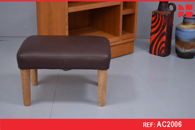 Vintage stool on oak legs with new brown leather upholstery.