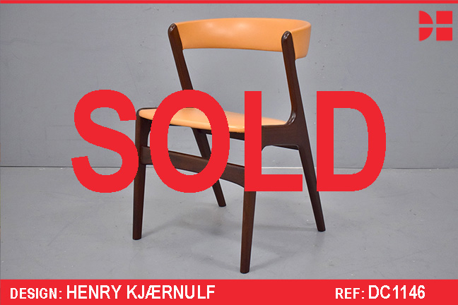 Vintage teak frame dining chair with orange vinyl upholstery